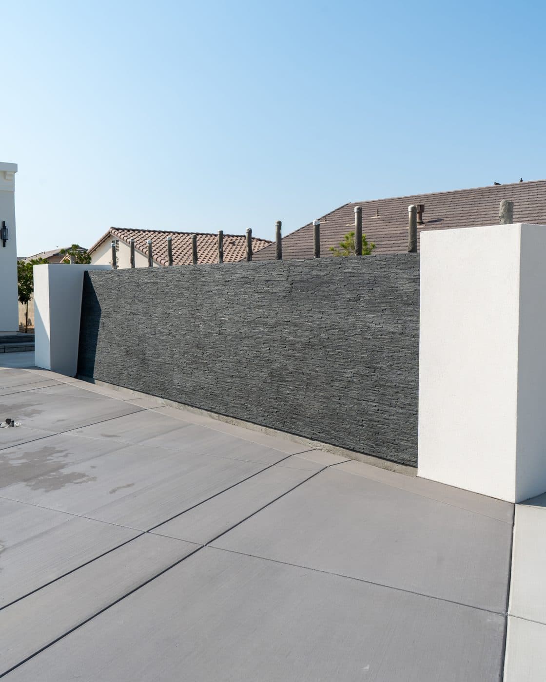 Completed slate and smooth-stucco feature wall by Intrepid Plastering, Bakersfield