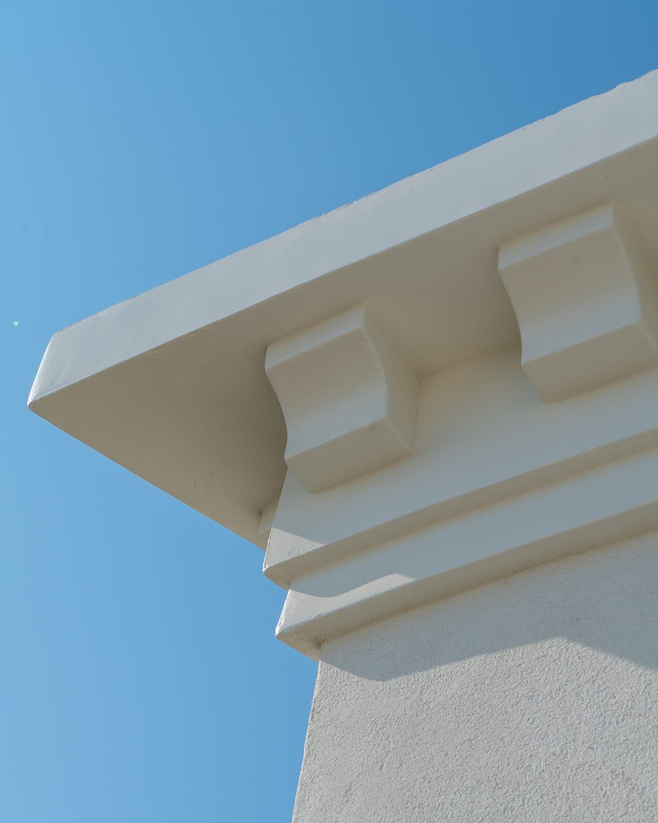 Plaster corbel and crown molding finish detail by Intrepid Plastering, Bakersfield