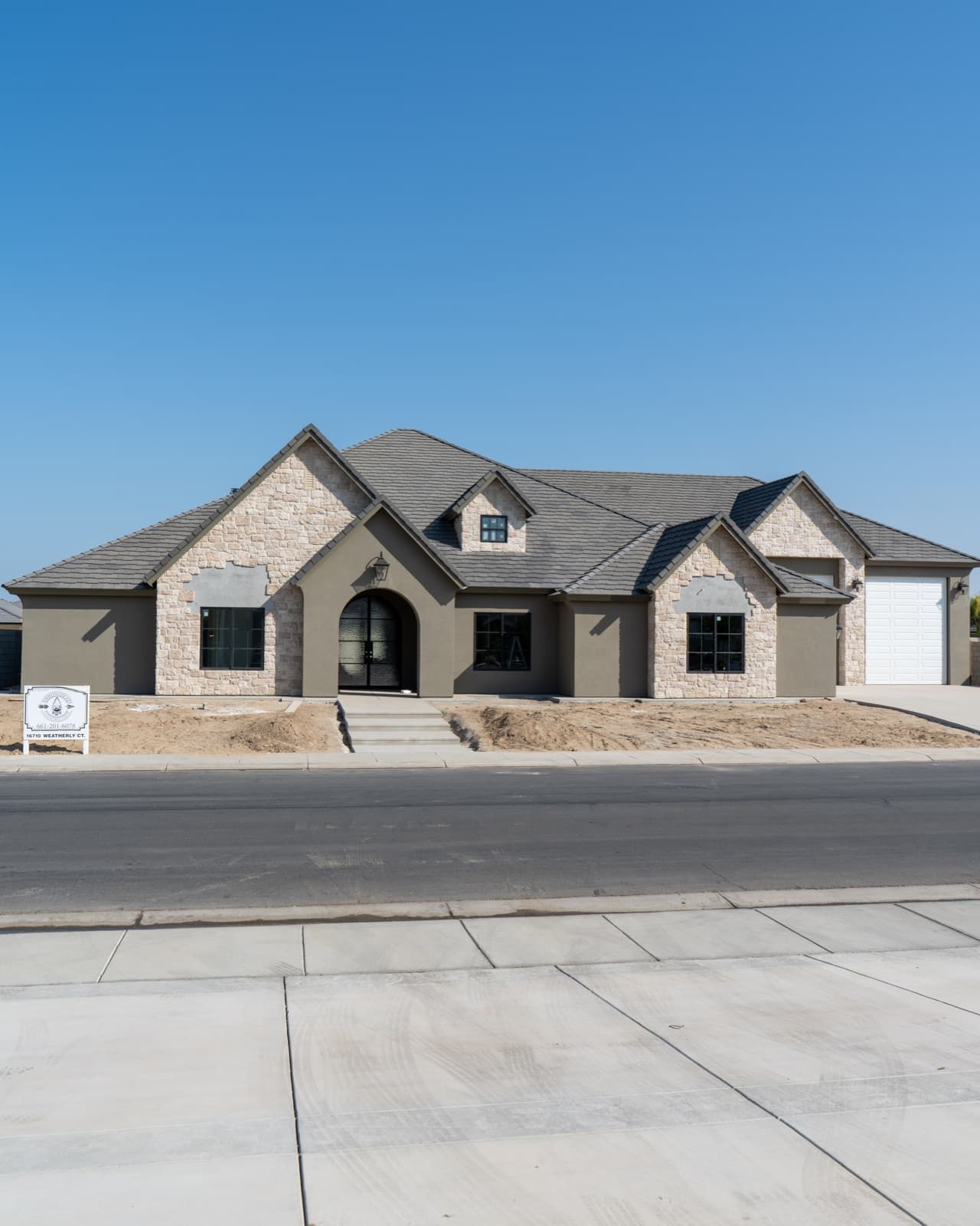 New home exterior — stone and stucco finish